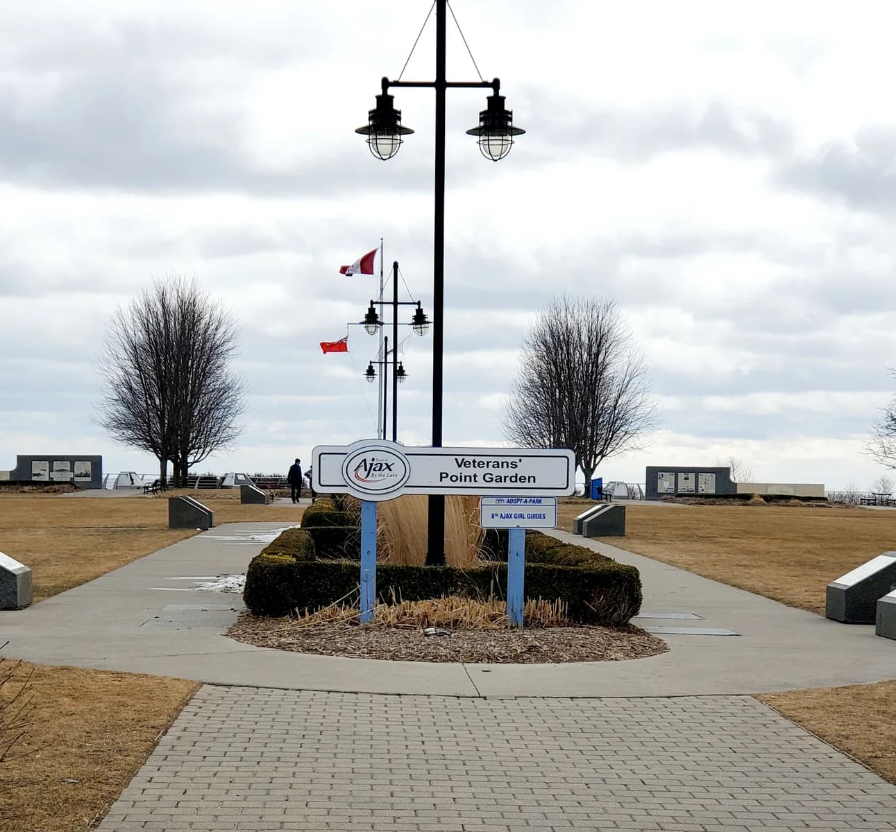 Veterans’ Point Gardens entrance sign, paths, memorial displays and waterfront in Ajax.