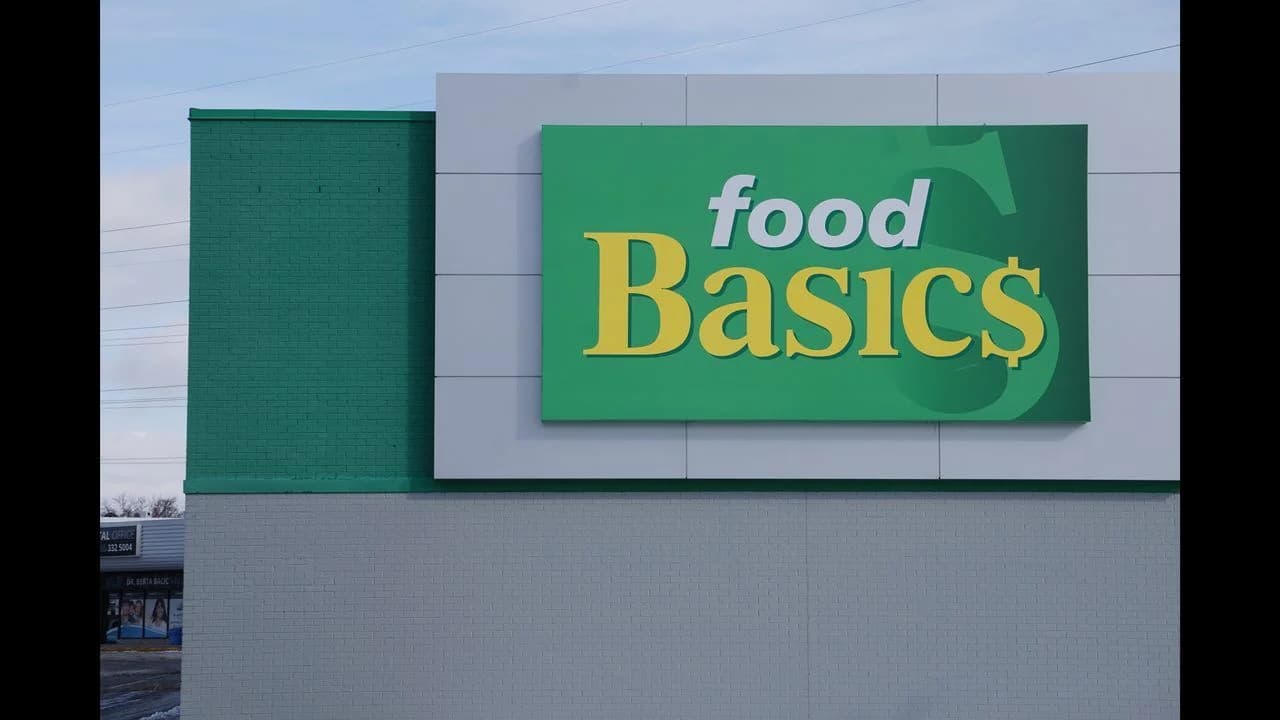 Exterior of a Food Basics grocery store with the store's red-and-green signage over the entrance